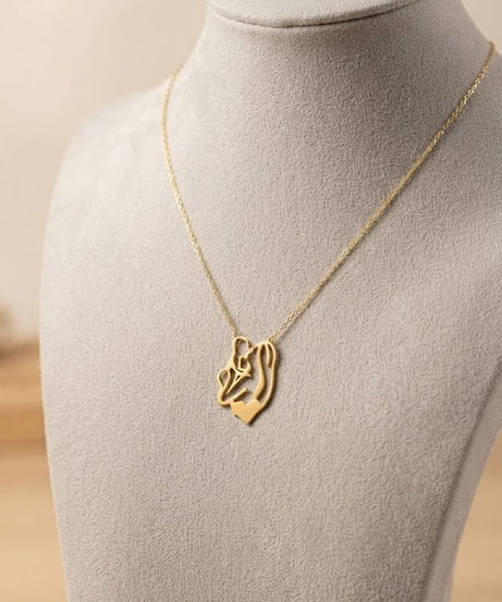 سلسلة ستانليس تيل ذهبي بقطعة ذهبية
